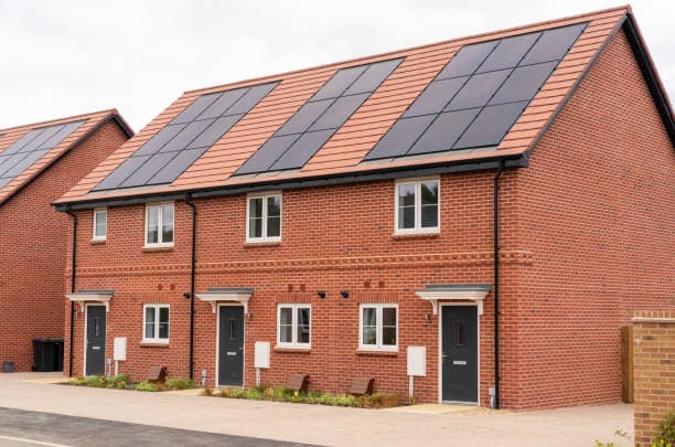 Solar PV panels installed on a red-brick home by JMS Eco